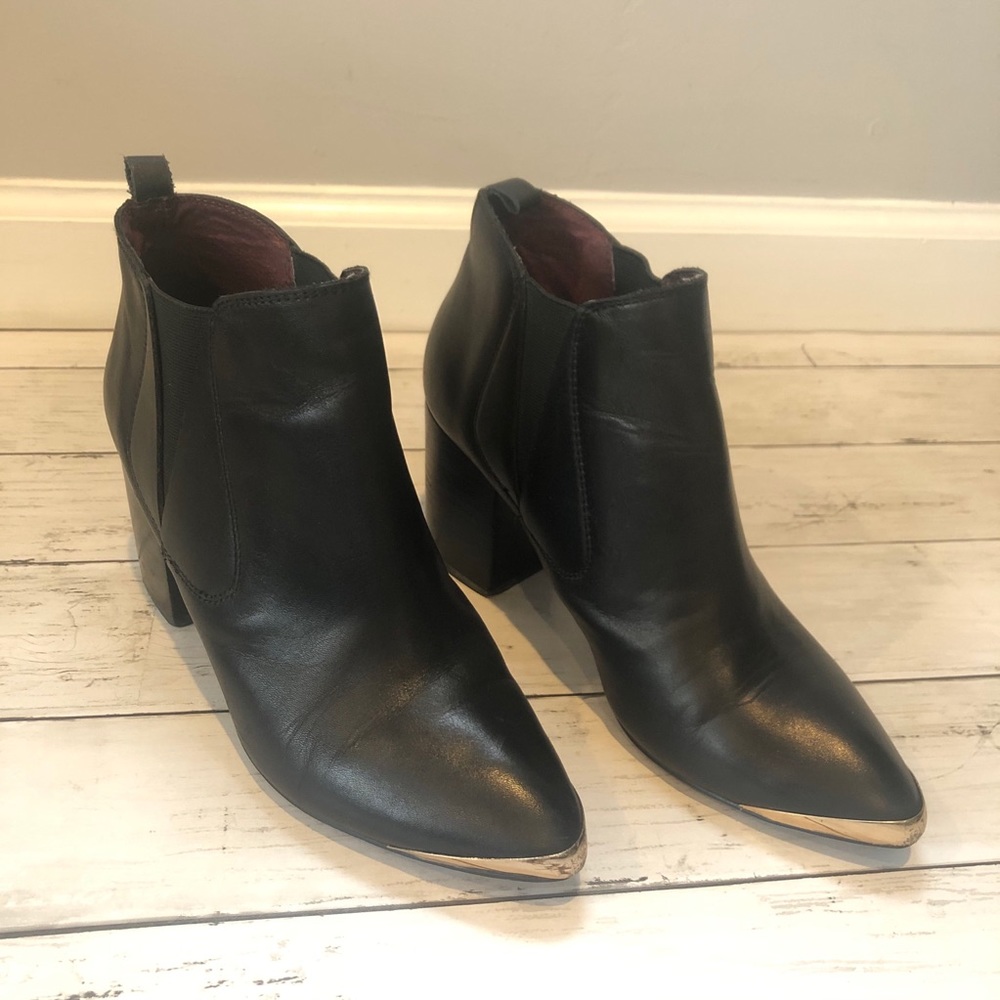 Black booties with metal cap toe